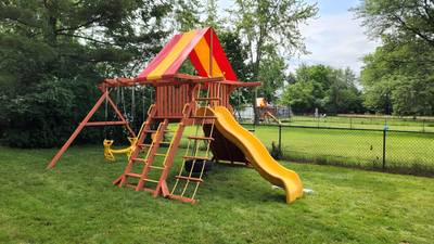 yellow and red playset with slides and swings Warrensville, OH